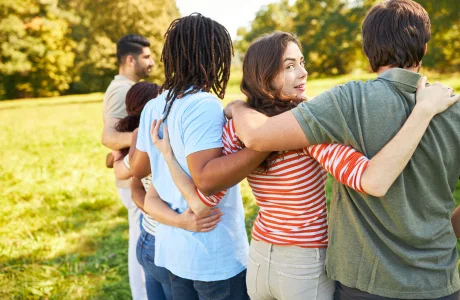 group of people hugging outdoor