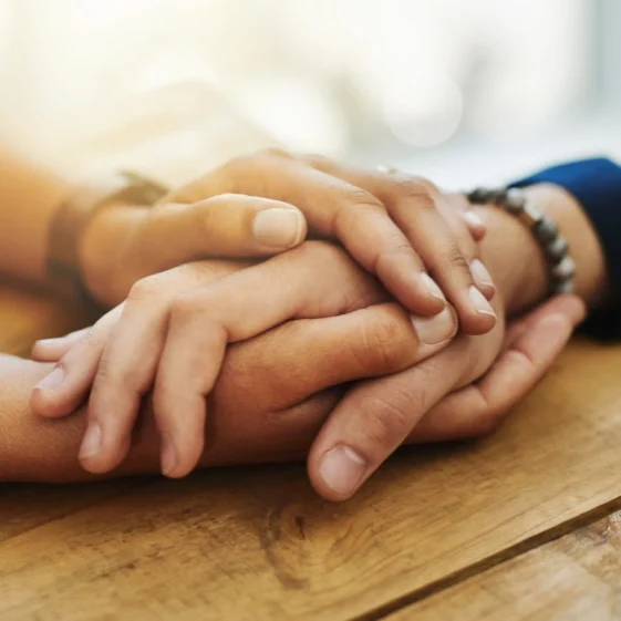 two person holding their hands